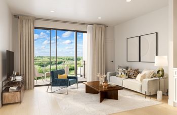 a living room with a couch and a coffee table and a balcony at Lilia, Lilydale, MN